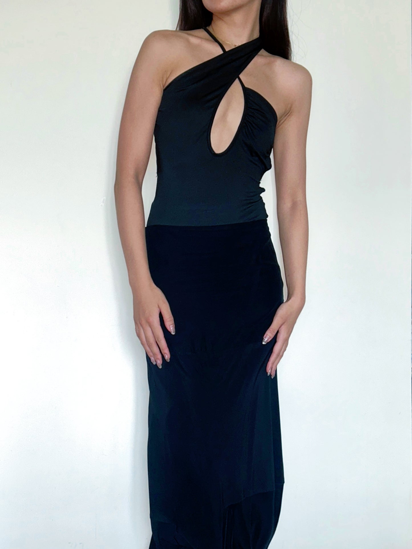 Black halter neck gown on a white background